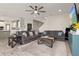 Open-concept living room offers generous seating, modern decor, and easy access to the kitchen and staircase at 12617 Oak Hill Way, Parrish, FL 34219