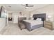 Bright main bedroom featuring plush carpeting and a decorative upholstered bed frame at 12617 Oak Hill Way, Parrish, FL 34219