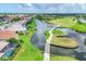 Beautiful aerial view of a golf course community with homes, water features, and lush landscaping at 1345 Reserve Dr, Venice, FL 34285