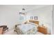 Well-lit bedroom with white walls, ceiling fan, window with blinds, and bed at 1345 Reserve Dr, Venice, FL 34285