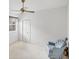Clean bedroom with light blue armchair and guitar at 1345 Reserve Dr, Venice, FL 34285