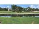 Community view highlighting the waterway and landscaping surrounding the area with a gazebo in the background at 1345 Reserve Dr, Venice, FL 34285