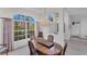 Dining room featuring a chandelier and ample natural light from the large windows at 1345 Reserve Dr, Venice, FL 34285