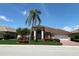 Attractive single-story home with a tile roof, two-car garage, and beautifully landscaped front yard at 1345 Reserve Dr, Venice, FL 34285