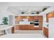 Spacious kitchen with oak cabinets, white appliances, tile floors, and white countertops at 1345 Reserve Dr, Venice, FL 34285