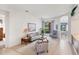 Bright living room featuring neutral colors, carpet floors and a view to the outdoors at 1345 Reserve Dr, Venice, FL 34285