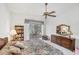Bright main bedroom featuring a bookcase and patio access with waterfront views at 1345 Reserve Dr, Venice, FL 34285