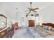 Bright main bedroom with ceiling fan, en-suite access, and traditional furnishings at 1345 Reserve Dr, Venice, FL 34285