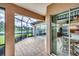 Screened-in patio with tile flooring and view of the water at 1345 Reserve Dr, Venice, FL 34285
