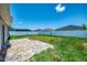 Landscaped backyard with a paver patio at 137 Hercules Dr, Rotonda West, FL 33947