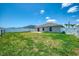 Spacious backyard with healthy green grass and fenced perimeter at 137 Hercules Dr, Rotonda West, FL 33947
