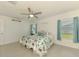 Inviting bedroom with a large window and a ceiling fan at 137 Hercules Dr, Rotonda West, FL 33947