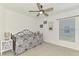 Bedroom featuring neutral tones, bright light, and a ceiling fan at 137 Hercules Dr, Rotonda West, FL 33947