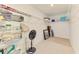 Spacious walk-in closet with ample shelving and tile floors at 137 Hercules Dr, Rotonda West, FL 33947