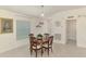 A bright dining area with a round table, tile floors, and a large window at 137 Hercules Dr, Rotonda West, FL 33947