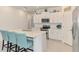 Bright kitchen featuring white cabinets, stainless steel appliances, and a quartz countertop at 137 Hercules Dr, Rotonda West, FL 33947