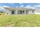 Spacious backyard with a covered patio perfect for outdoor entertaining at 137 Mariner Ln, Rotonda West, FL 33947