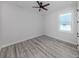 Inviting bedroom with wood-style floors and a ceiling fan for added comfort at 137 Mariner Ln, Rotonda West, FL 33947
