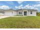 Beautiful single-story home with manicured lawn and a two-car garage at 137 Mariner Ln, Rotonda West, FL 33947