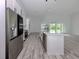 Bright kitchen with a center island, stainless steel appliances, and an open layout at 137 Mariner Ln, Rotonda West, FL 33947