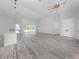 Spacious open-concept living area with luxury flooring and plenty of natural light at 137 Mariner Ln, Rotonda West, FL 33947