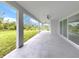 Inviting covered patio overlooking a lush green lawn and mature landscaping at 137 Mariner Ln, Rotonda West, FL 33947