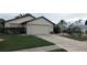 Attractive home with a two-car garage, updated siding, and mature palm trees at 14261 Palm Ter, Port Charlotte, FL 33953
