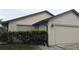 Single-Gathering home with a two-car garage and well-maintained landscaping at 14261 Palm Ter, Port Charlotte, FL 33953