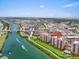 Scenic aerial view of waterfront condos near a bridge and bustling city area at 157 Tampa E Ave # 305, Venice, FL 34285