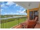 Balcony with scenic river views, features comfortable lounge seating for relaxation and enjoying the outdoors at 157 Tampa E Ave # 305, Venice, FL 34285