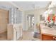Well-lit bathroom with glass block shower, double sinks, and towel warmer, providing modern convenience at 157 Tampa E Ave # 305, Venice, FL 34285