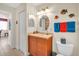 Bathroom featuring a vanity with sink, tile floor, and colorful decor at 157 Tampa E Ave # 305, Venice, FL 34285