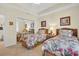 Bedroom featuring twin beds, neutral carpeting, and mirrored closet doors at 157 Tampa E Ave # 305, Venice, FL 34285