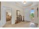 Inviting foyer featuring tile flooring, neutral walls, and access to the main bedroom at 157 Tampa E Ave # 305, Venice, FL 34285