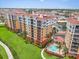 Stunning condos with vibrant exteriors, lush landscaping, and a beautiful pool area at 157 Tampa E Ave # 305, Venice, FL 34285
