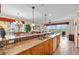 Bright and open kitchen with granite countertops and stainless steel appliances at 157 Tampa E Ave # 305, Venice, FL 34285