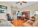 Inviting living space featuring wood floors, comfortable furniture, and an office space at 157 Tampa E Ave # 305, Venice, FL 34285