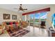 Living room with comfortable seating and a sliding door to a balcony with serene water views at 157 Tampa E Ave # 305, Venice, FL 34285