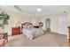 Comfortable bedroom featuring carpet floors, neutral walls, and ample natural light from surrounding windows at 157 Tampa E Ave # 305, Venice, FL 34285