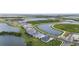 Scenic aerial view of the neighborhood featuring multiple ponds and beautiful homes at 18136 Foxtail Loop, Venice, FL 34293