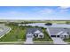 An aerial view of beautiful single-Gathering home with a lake view at 18136 Foxtail Loop, Venice, FL 34293
