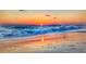 A serene beach sunset with waves gently lapping the shore, perfect for tranquil evening walks and relaxation at 18136 Foxtail Loop, Venice, FL 34293