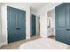 Bedroom with direct entry to bathroom with blue door and large closet with bi-fold doors at 18136 Foxtail Loop, Venice, FL 34293