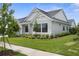 Beautiful home with a manicured lawn and carefully chosen landscaping at 18136 Foxtail Loop, Venice, FL 34293