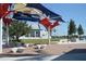 Community pavilion featuring modern architectural elements, manicured lawn, and lake views at 18136 Foxtail Loop, Venice, FL 34293
