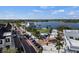 Community aerial view showcasing a beautiful streetscape, lake, park, and colorful playground, highlighting the neighborhood's appeal at 19927 Bridgetown Loop, Venice, FL 34293