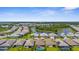 Residential area featuring many single Gathering homes with screened pools and neighborhood lakes at 19927 Bridgetown Loop, Venice, FL 34293