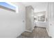 Modern bathroom with a glass-enclosed shower, tiled walls, and wood-look flooring at 19927 Bridgetown Loop, Venice, FL 34293