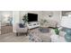 Cozy living room with comfortable seating, a decorative rug, and a TV at 19927 Bridgetown Loop, Venice, FL 34293