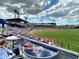 A bustling ballpark with a view of the field and seating overlooking the action at 20169 Cristoforo Pl, Venice, FL 34293